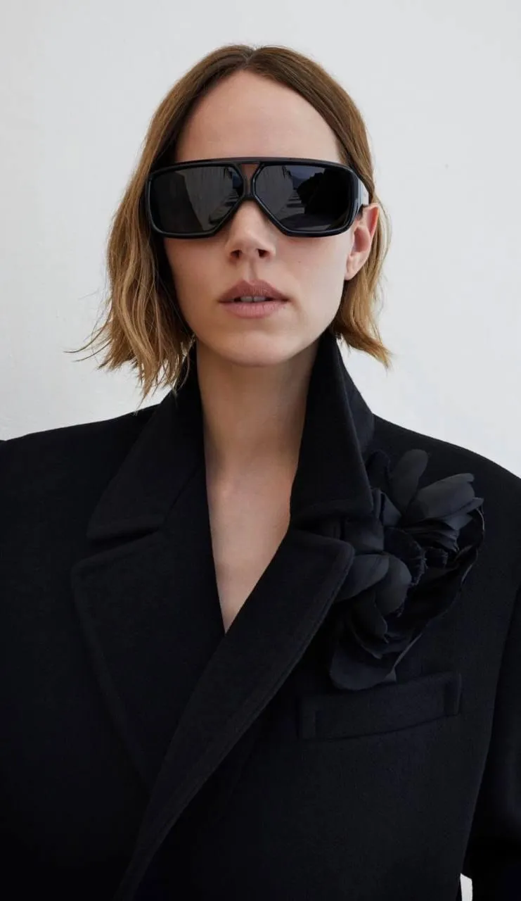Modern chic portrait with oversized sunglasses and a blazer