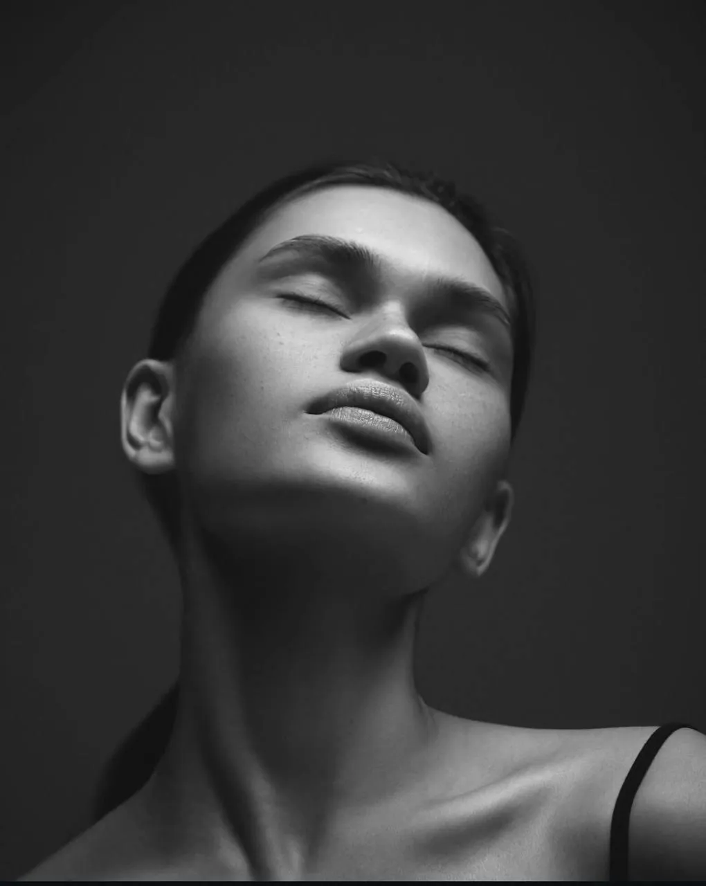 Monochrome of a woman face with calm eyes closed expression