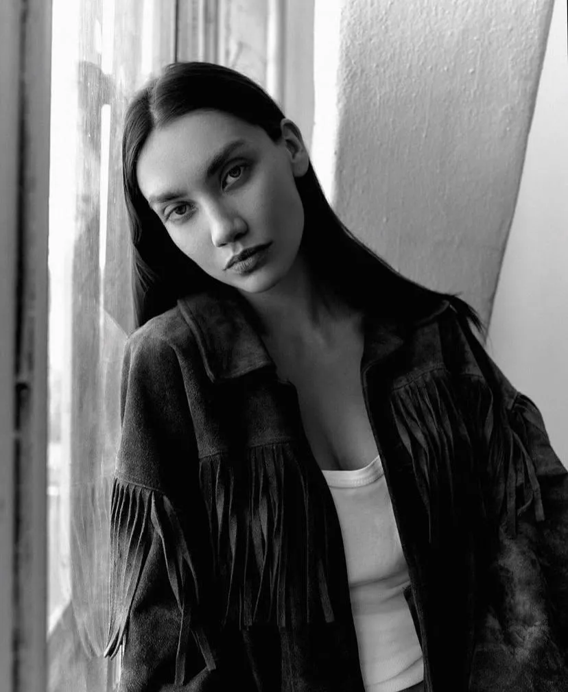 Monochrome portrait of a stylish woman in a leather jacket