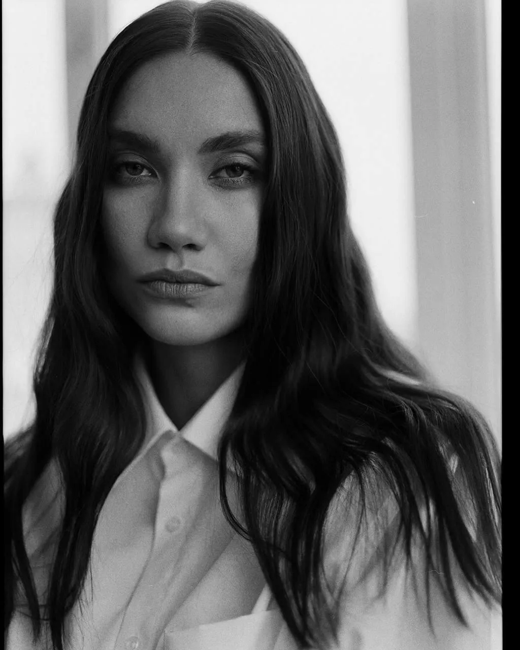 Monochrome Studio Portrait of a Woman with a Serious Face