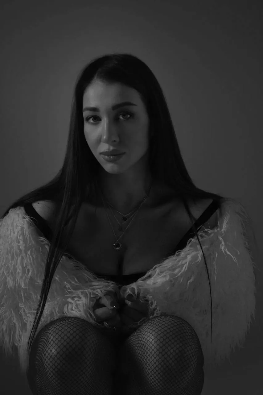 Moody black and white portrait of a woman in lingerie image