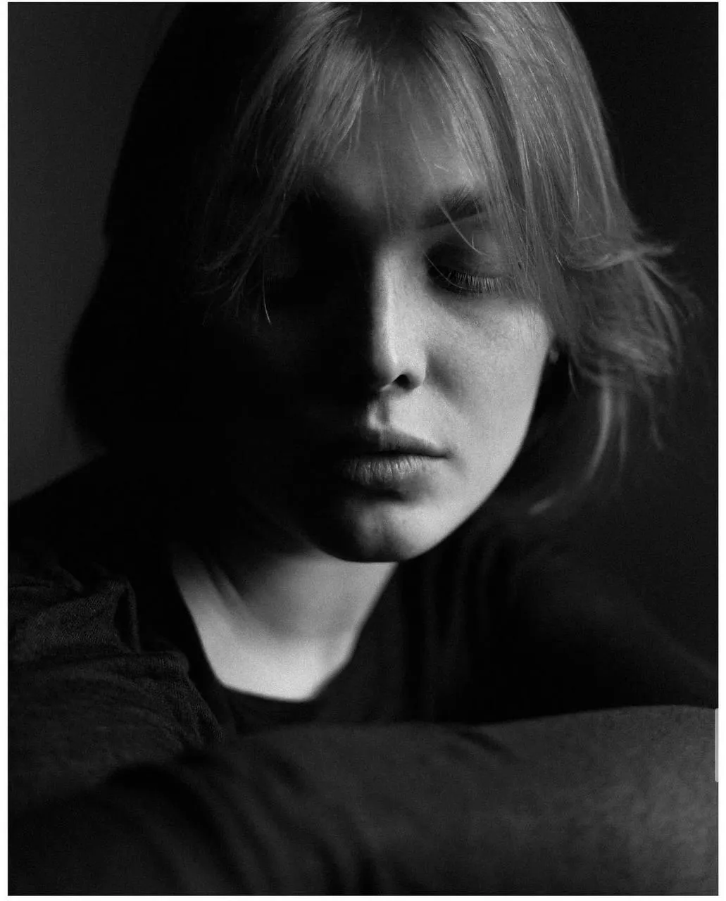 Moody Black And White Portrait of a Young Woman in Shadows