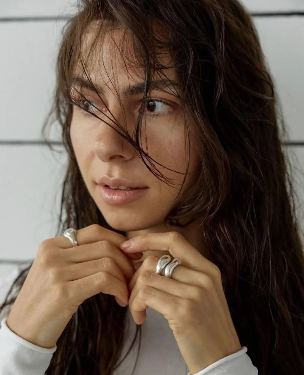 Natural Beauty with Tousled Hair And a Thoughtful Gaze Image