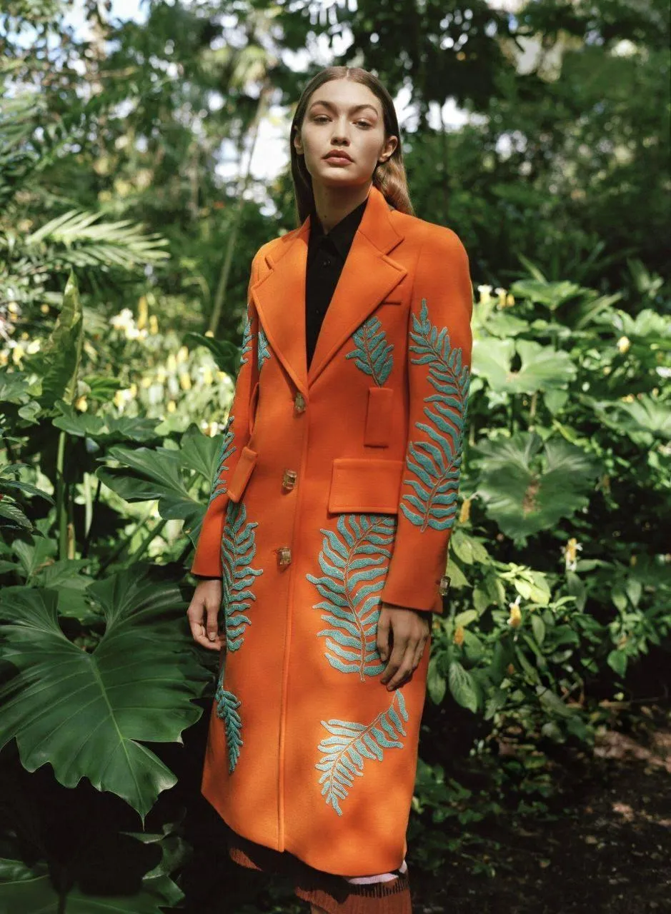 Outdoor Orange Coat Style Shoot Surrounded by Greenery Image