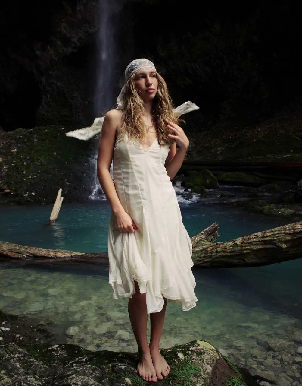 Outdoor Photo of Woman with Flowing Dress Near the Water