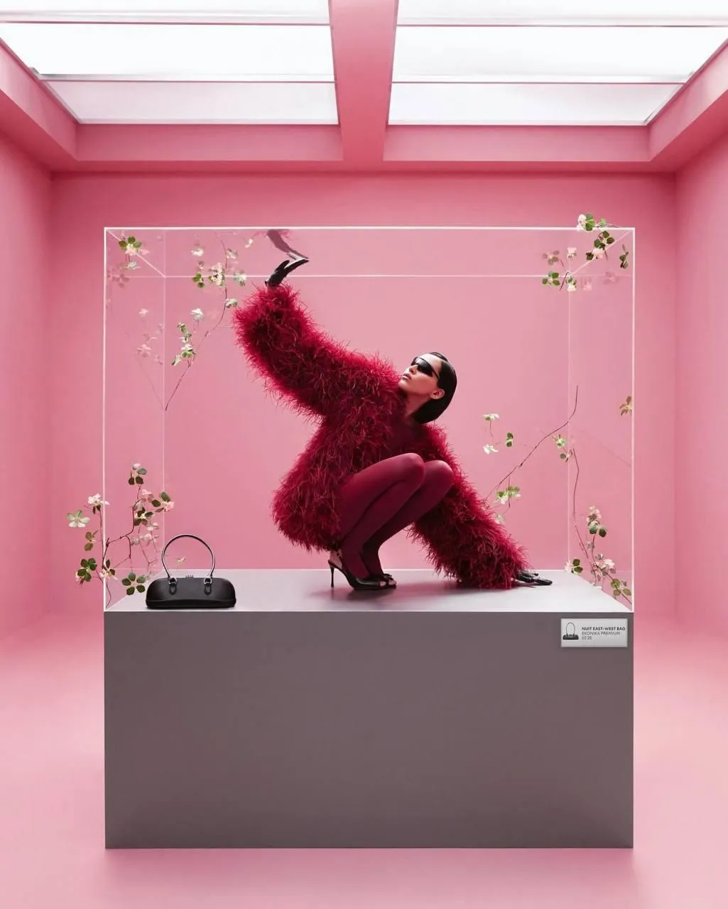 Person in pink furry outfit posing in bright pink room image