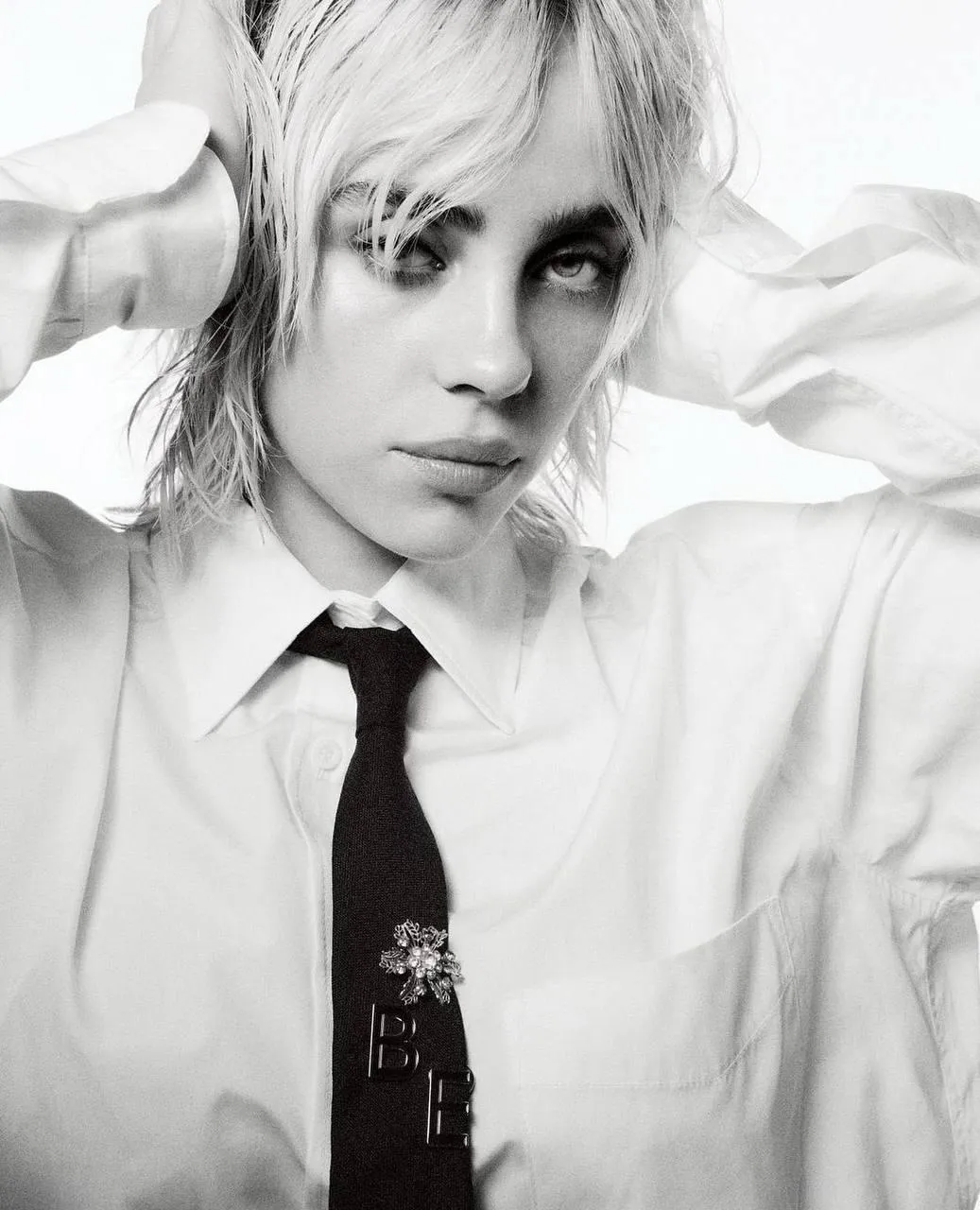 Platinum Blonde Woman in a Shirt And Tie with Smoky Eyes