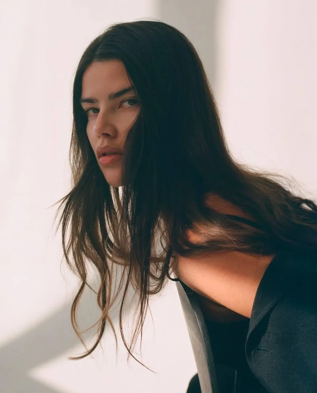Portrait of a woman with long hair in natural indoor light