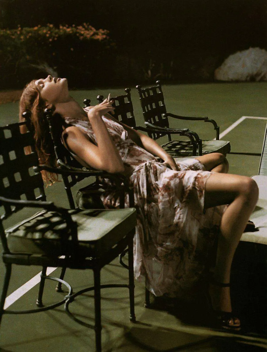 Relaxed Model Lying Back on Chairs Outdoors in the Daylight