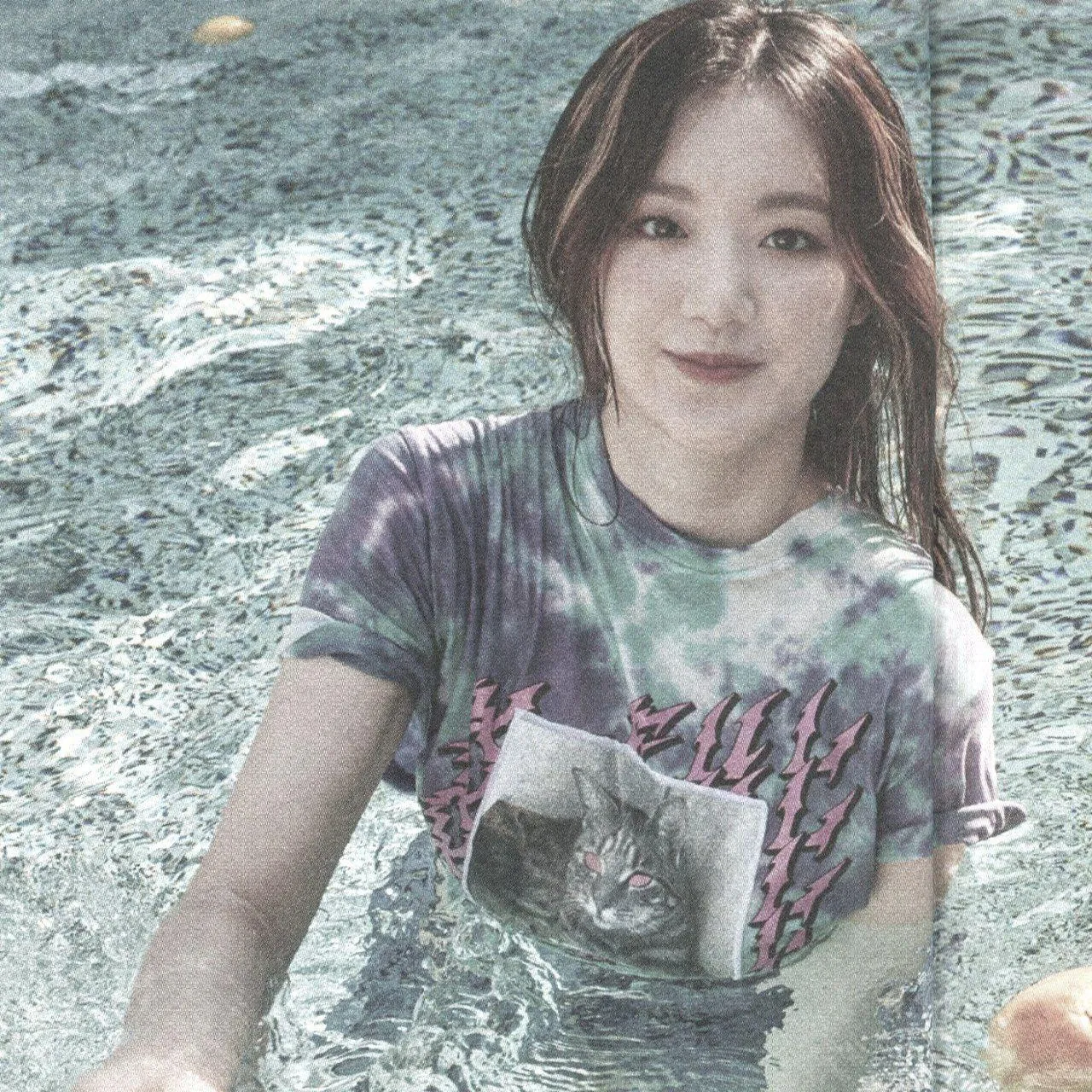 Smiling Woman Underwater with a T Shirt And Long Hair Image