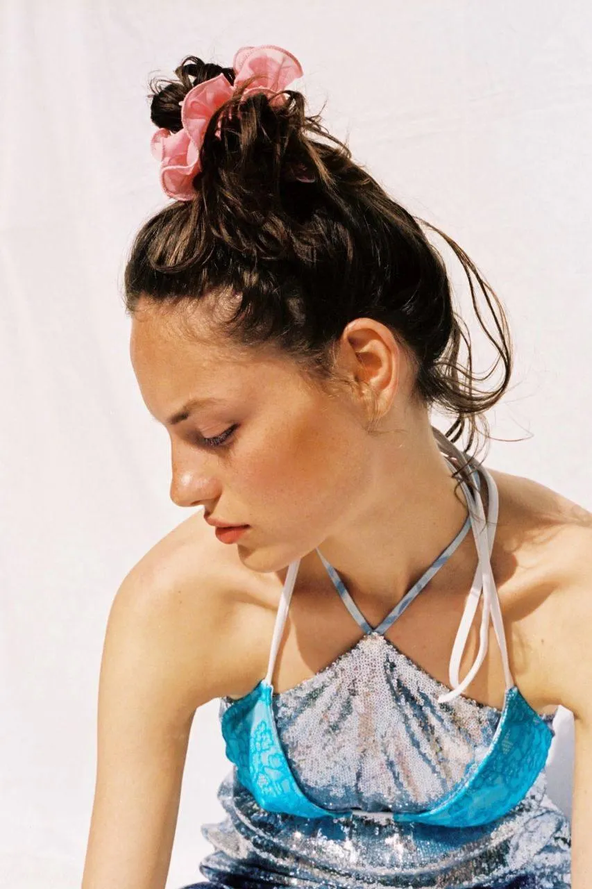 Sporty Woman in a Colorful Activewear with Tied Up Hair