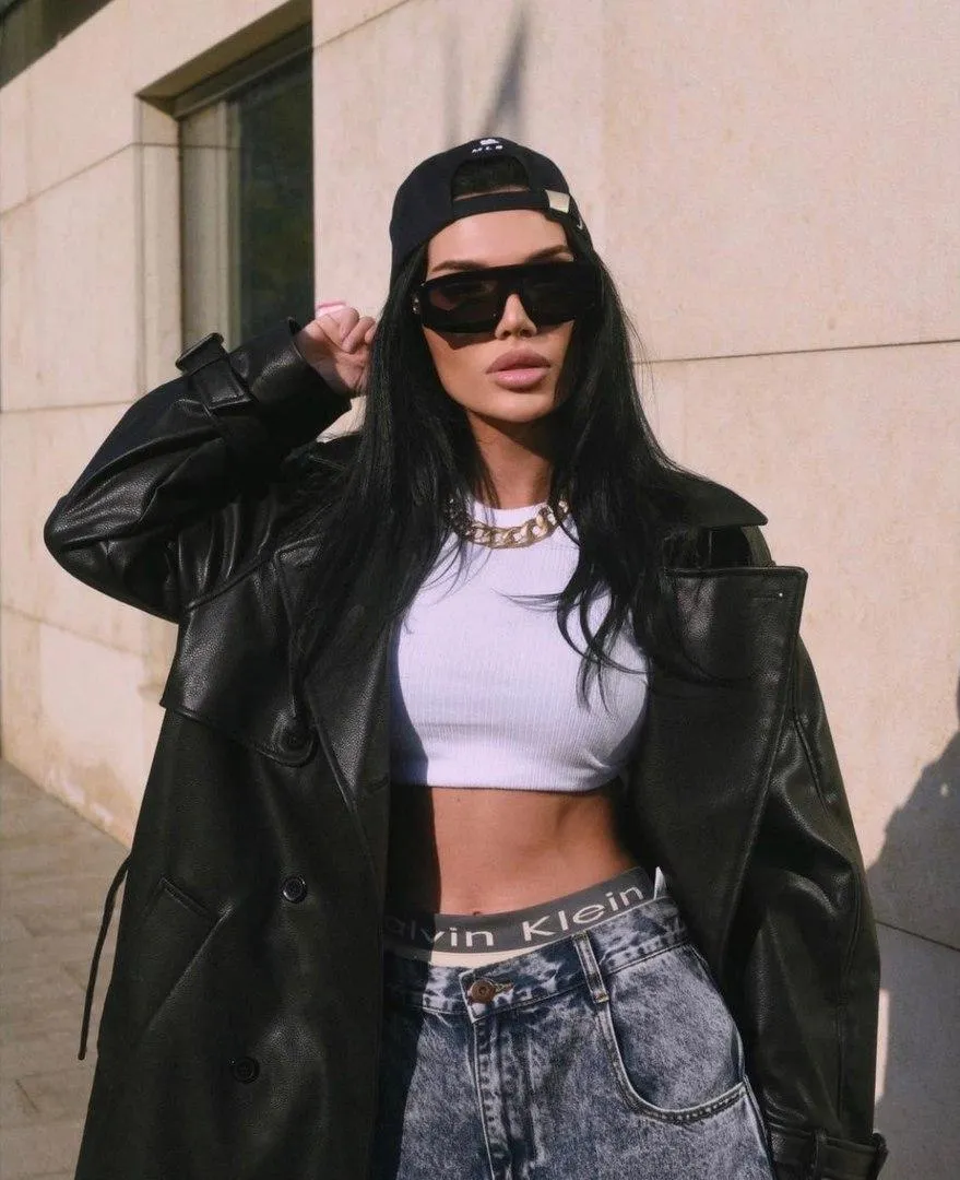 Street Style Model in a Leather Jacket And Ripped Jeans