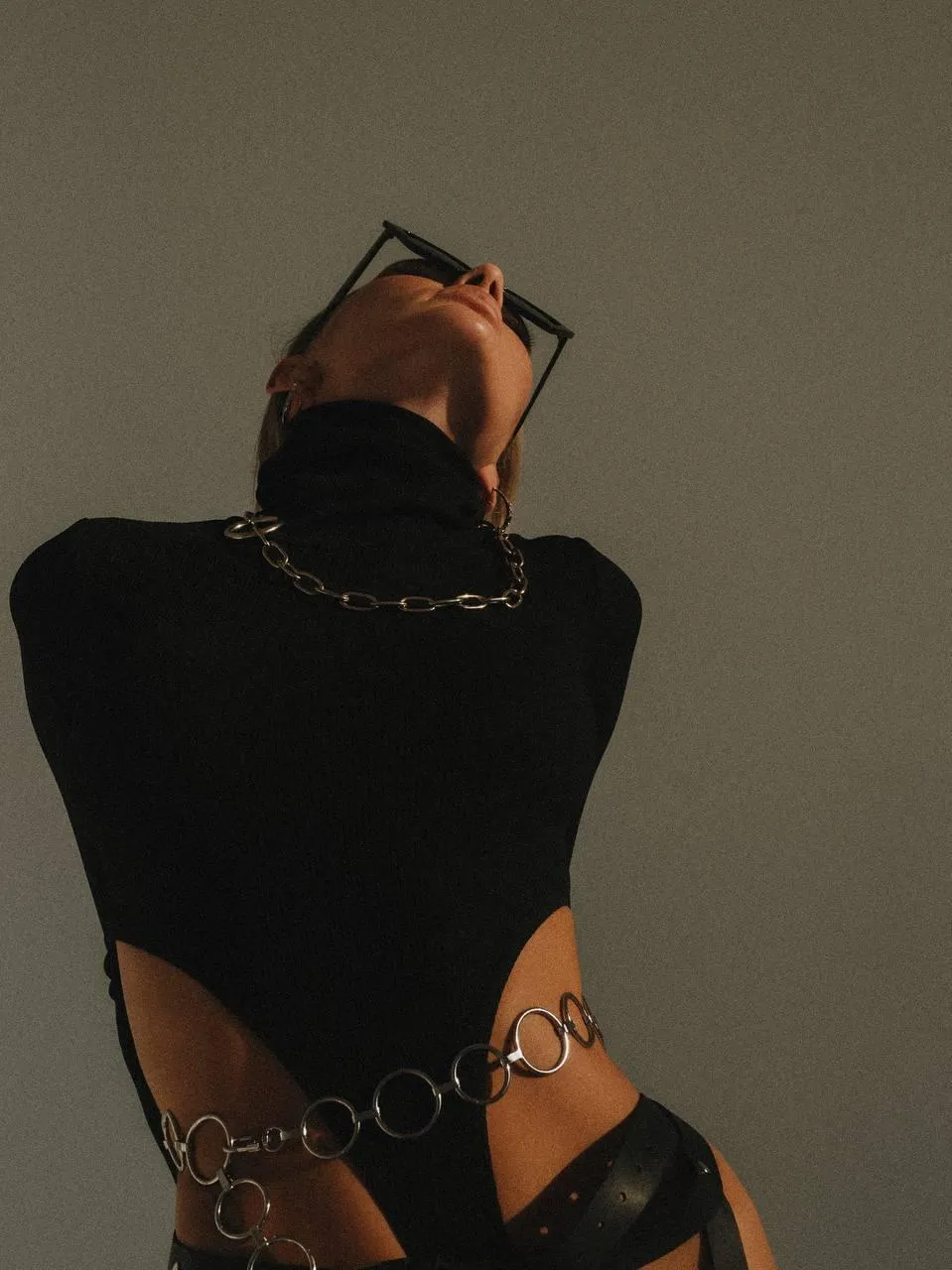 Stylish Fashion Pose with a Dark Turtleneck And Chains Image