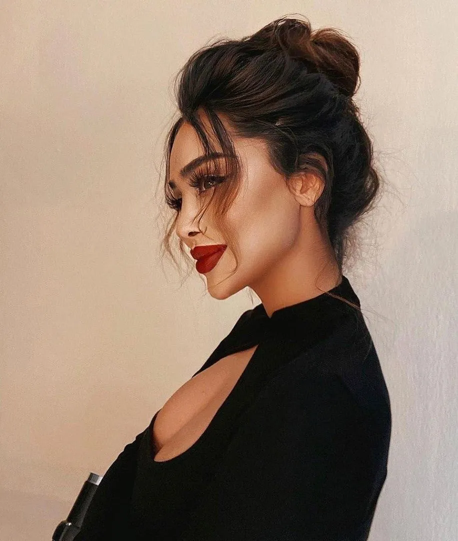 Stylish Woman Looking Down with Red Lipstick Detail Image