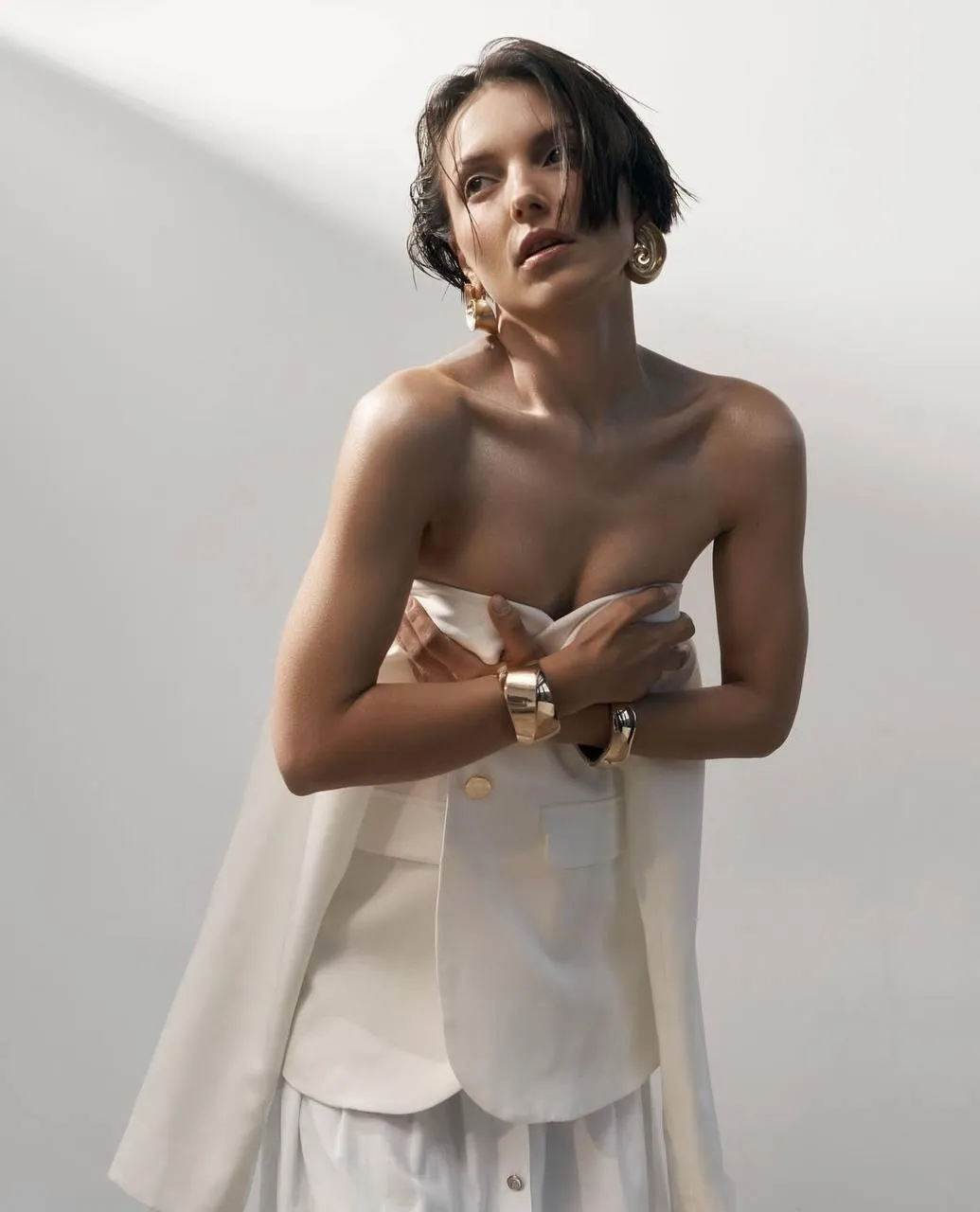 Stylish woman wearing an elegant fashion dress in the studio