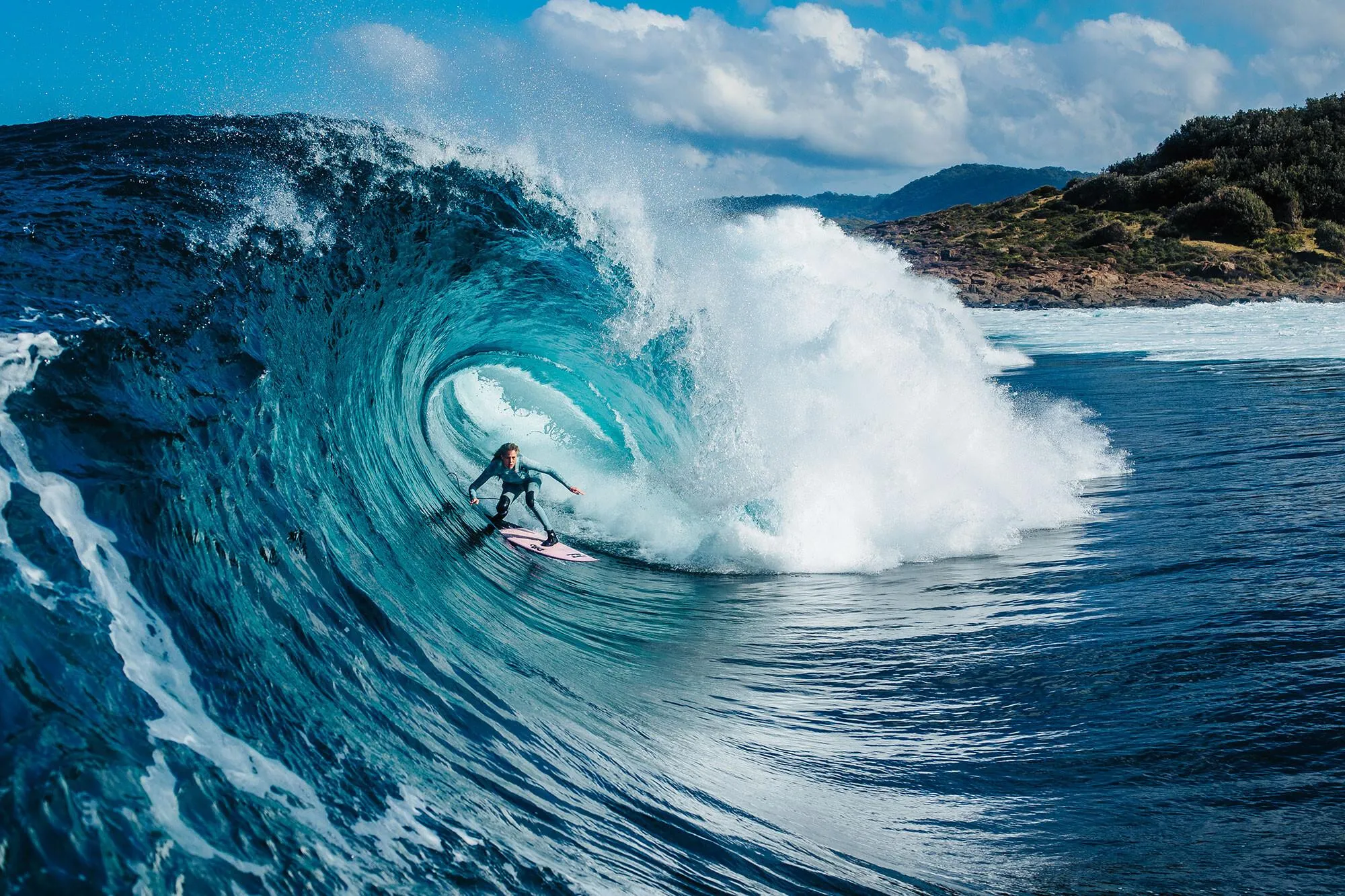 Surfer Inside a Huge Crashing Wave in the Deep Blue Sea