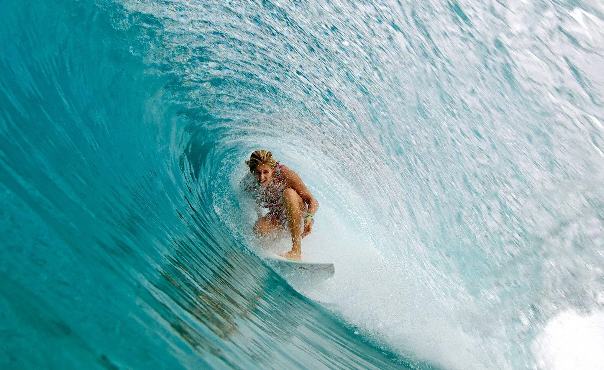 Surfer Riding Perfectly Inside a Crystal Blue Wave Tube