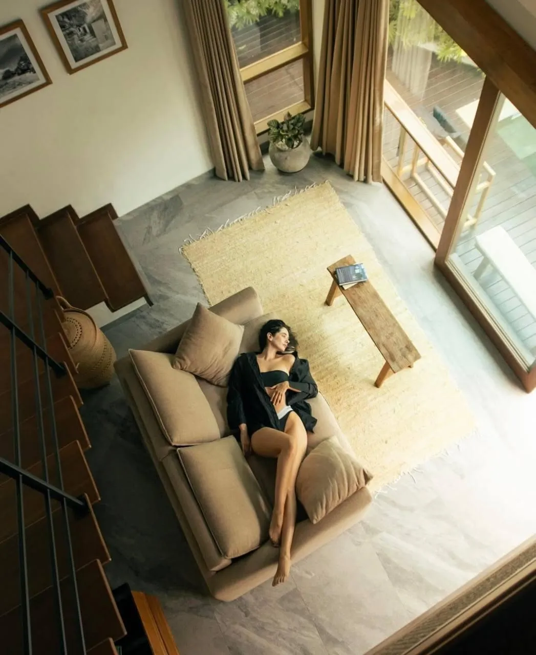 Top View of Woman in a Robe Relaxing Near Window Wallpaper