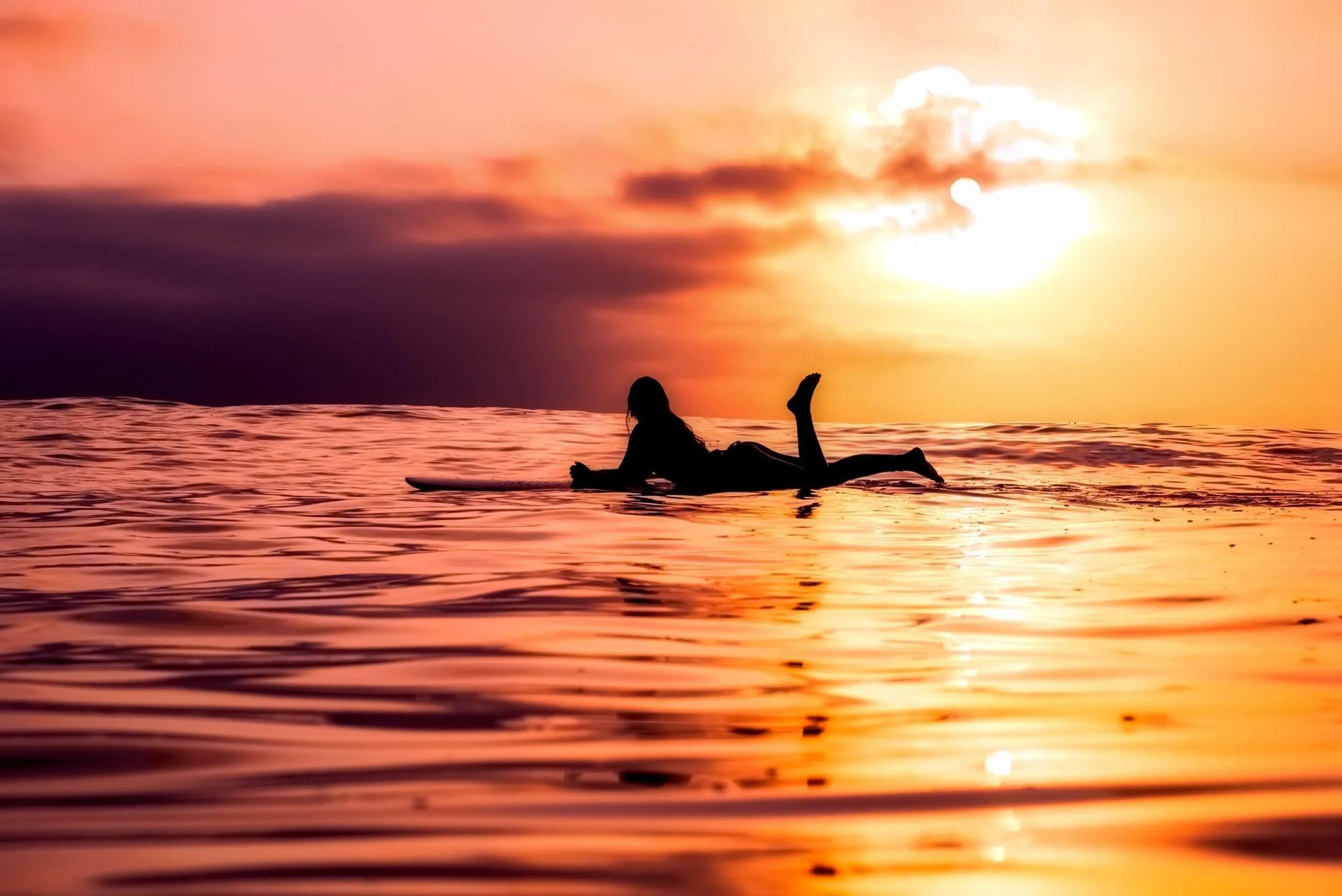 Two People Kayaking at Sunset in Beautiful Ocean Scenery
