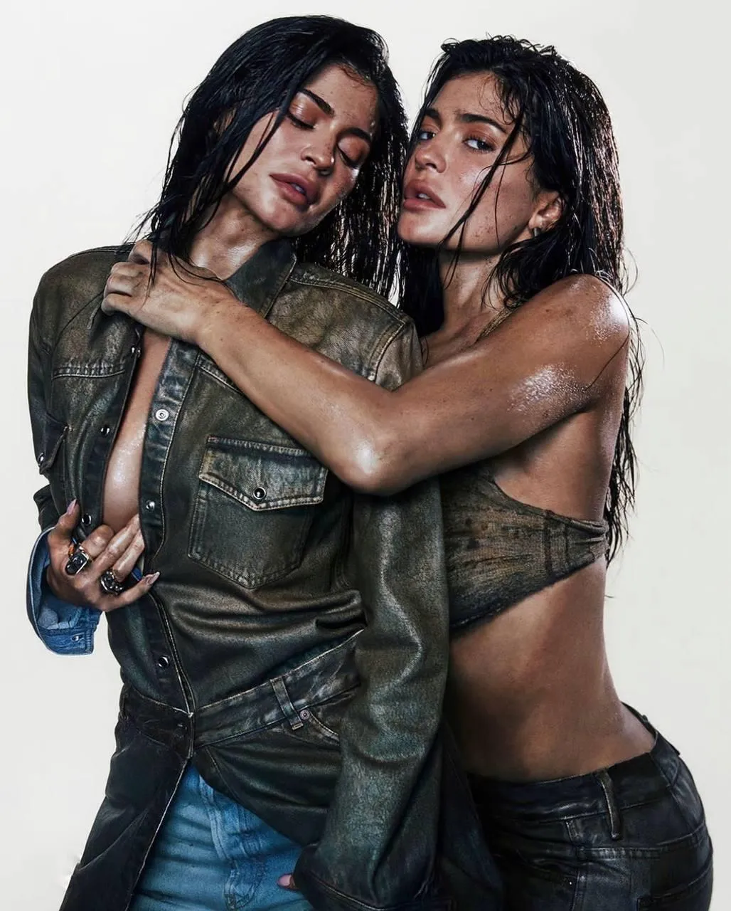 Two Women in Wet Clothes Embracing And Smiling Warmly Image