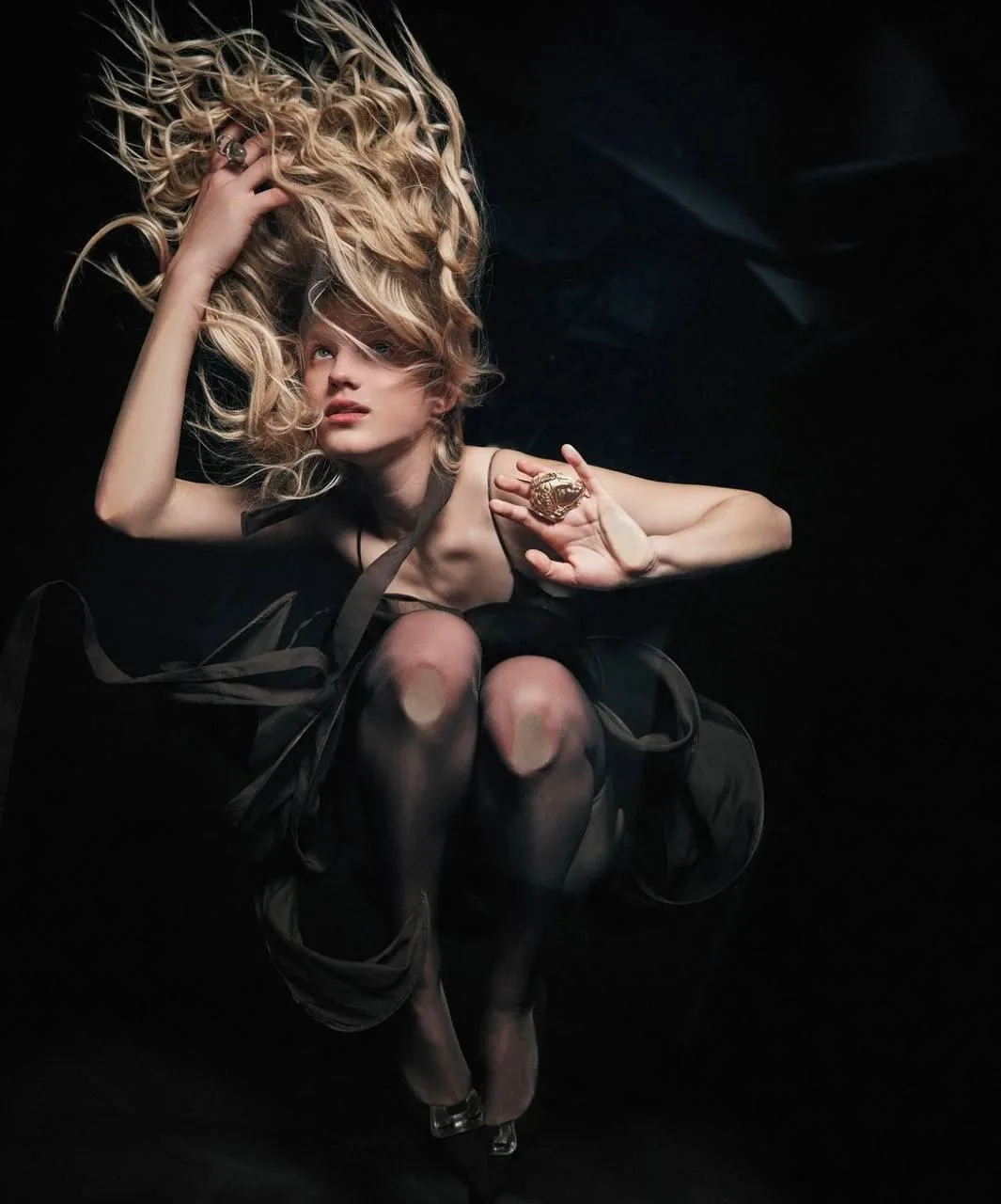 Woman Dancing in Dramatic Lighting with Flowing Hair Motion