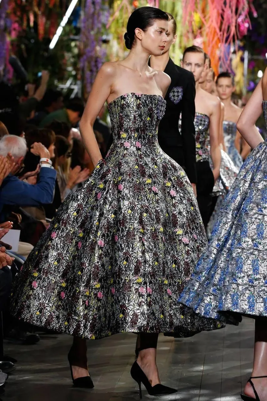 Woman Fashion Model Walking on the Runway in a Floral Dress