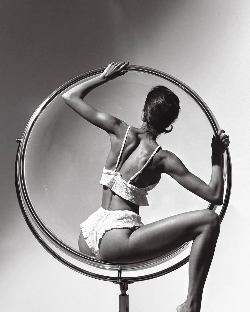Woman in a Bikini Inside a Modern Circular Hanging Chair