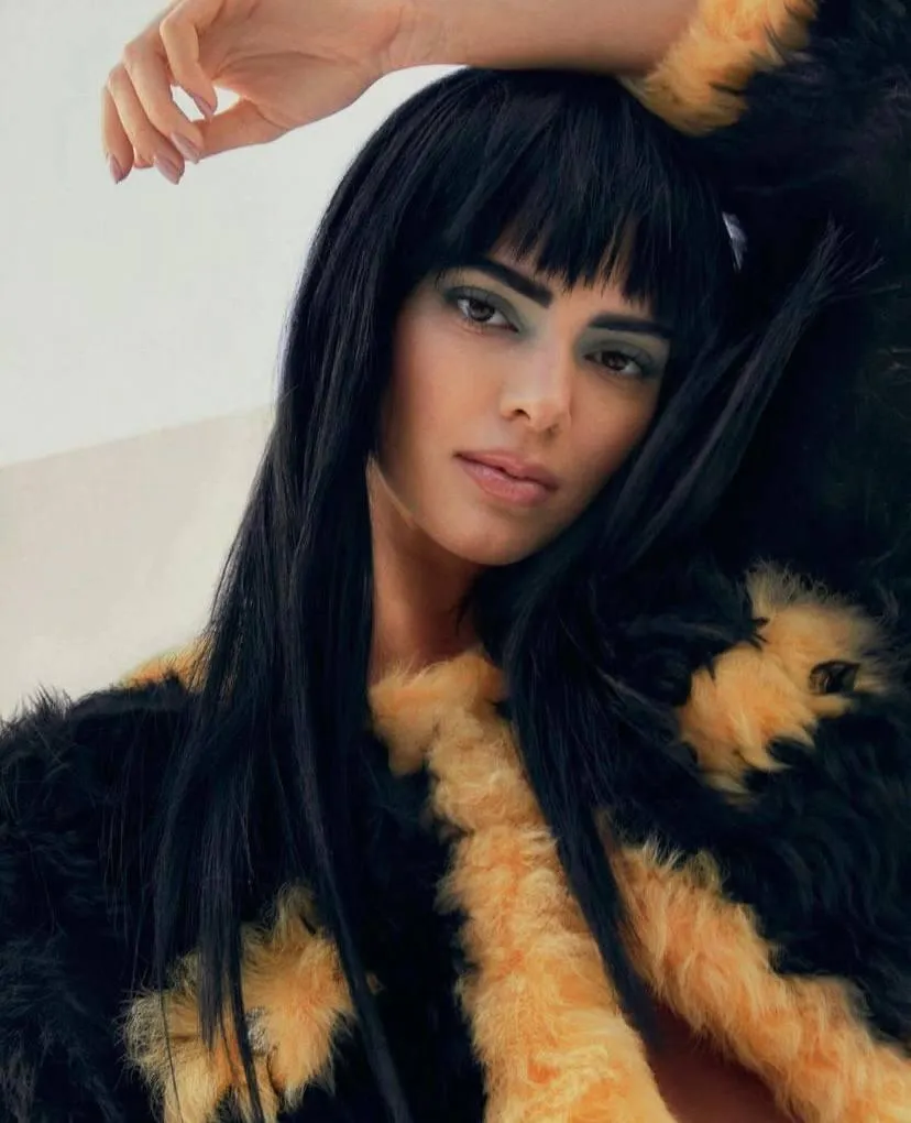 Woman in a furry jacket looking confident in modern fashion
