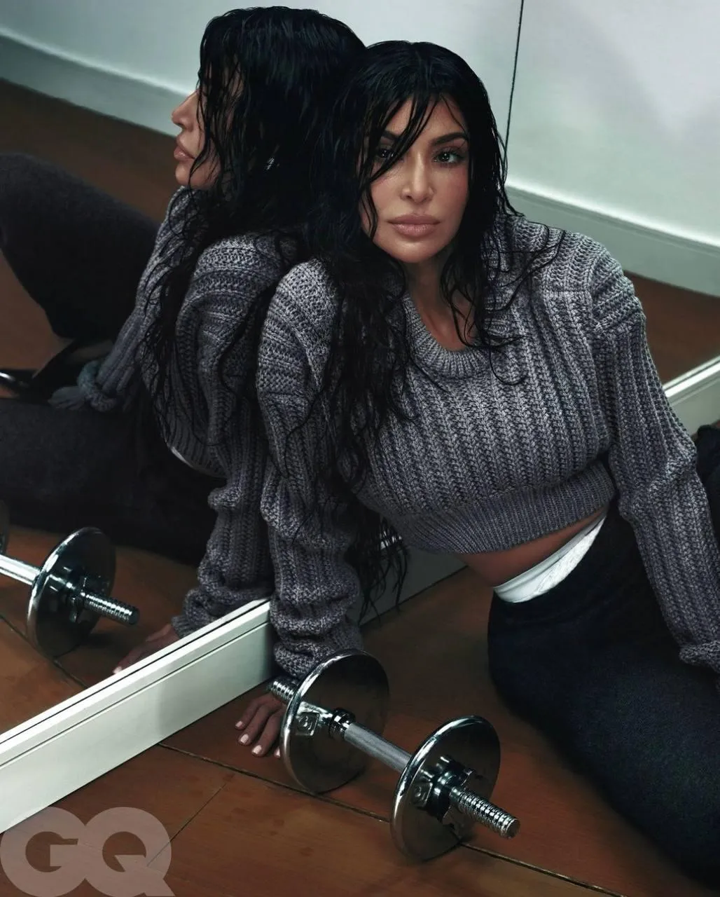 Woman in a Gray Sweater Posing with a Mirror Free Wallpaper