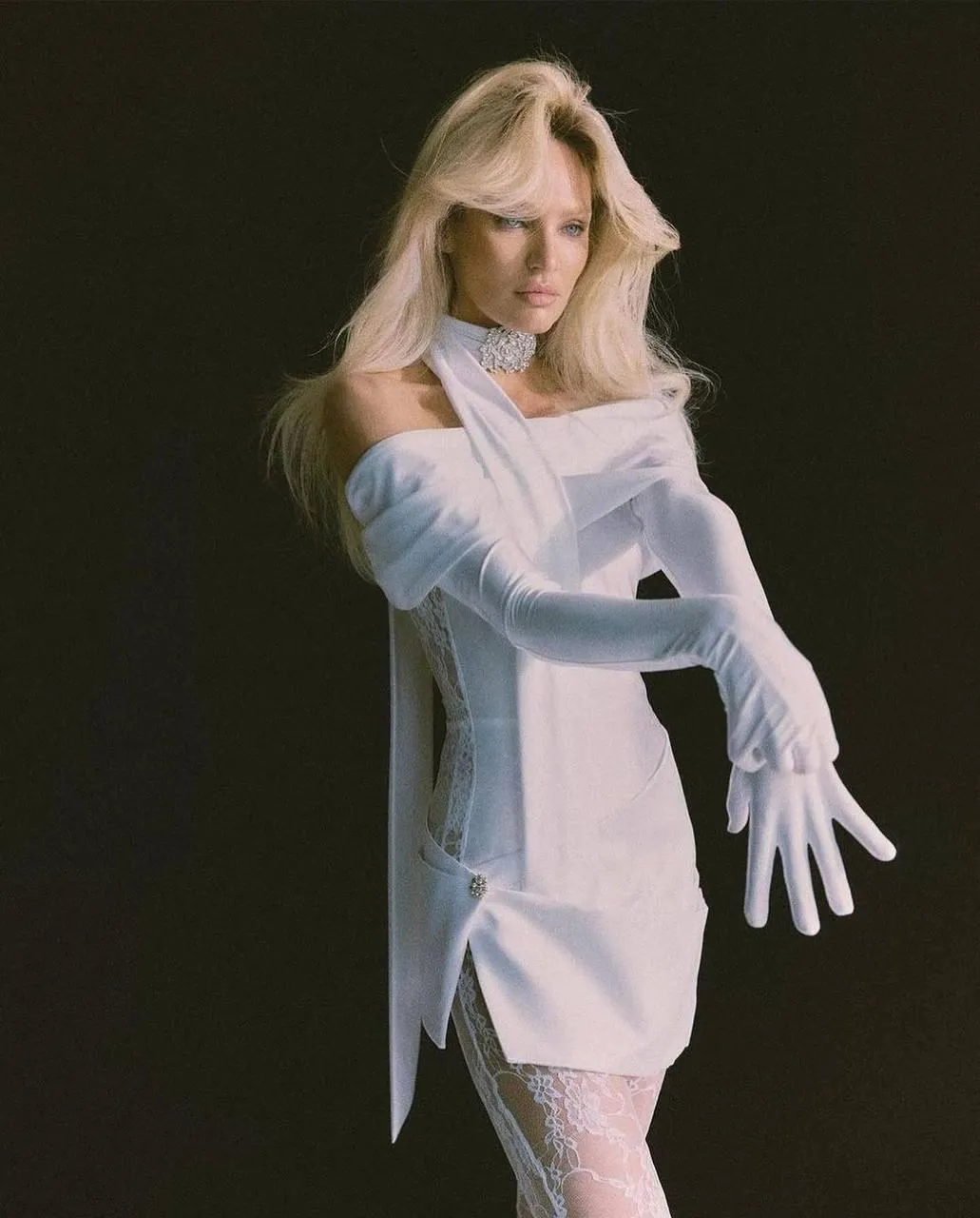 Woman in a Pastel Blue Dress Striking an Elegant Indoor Pose