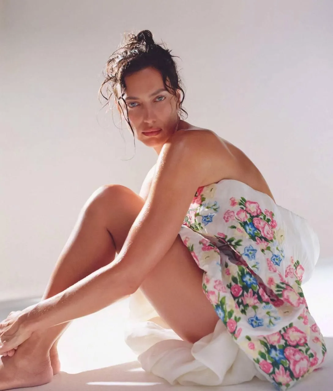 Woman in Floral Robe Sitting in Bright Natural Light Setting