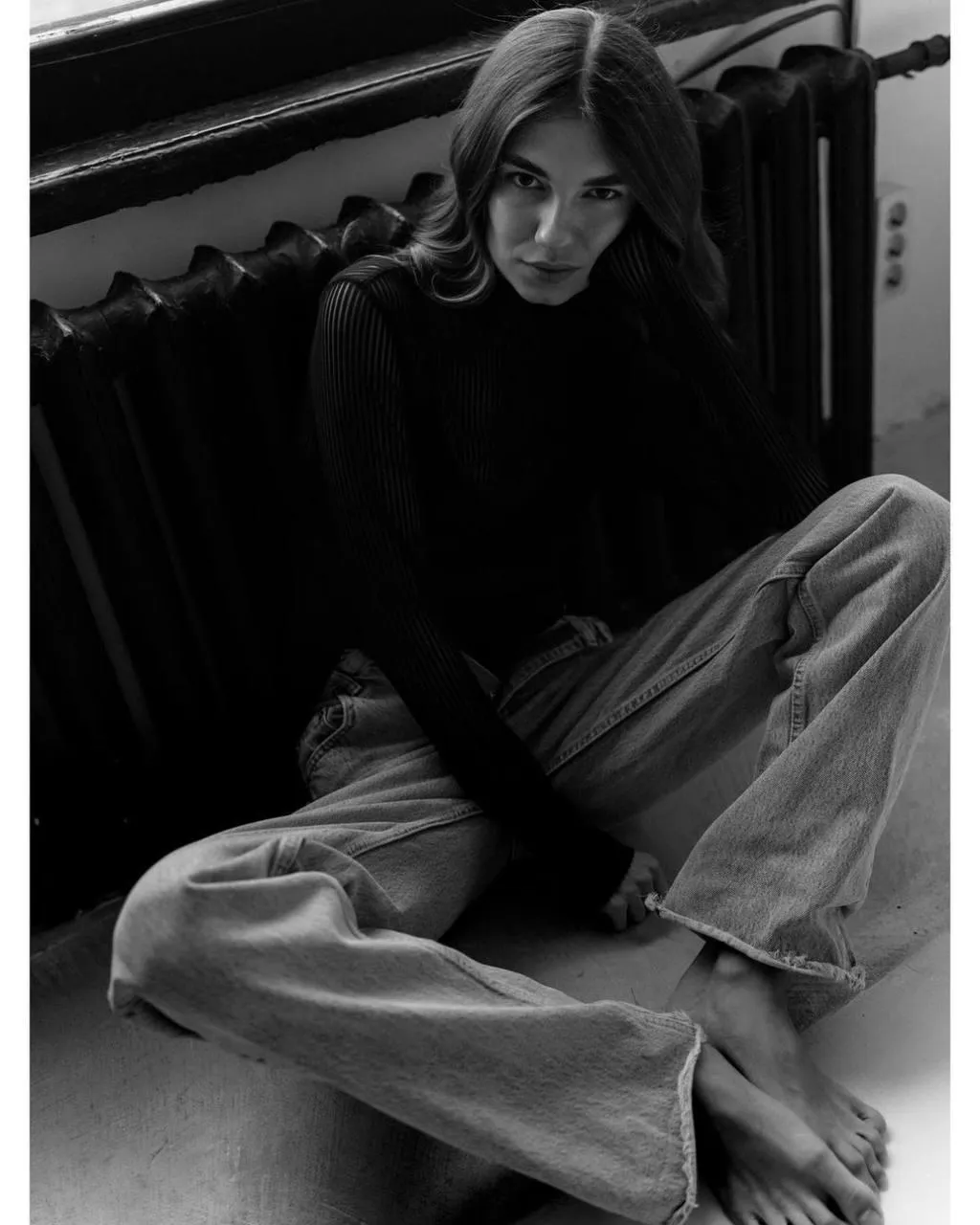Woman in Oversized Pants And a Sweater Sitting on the Floor