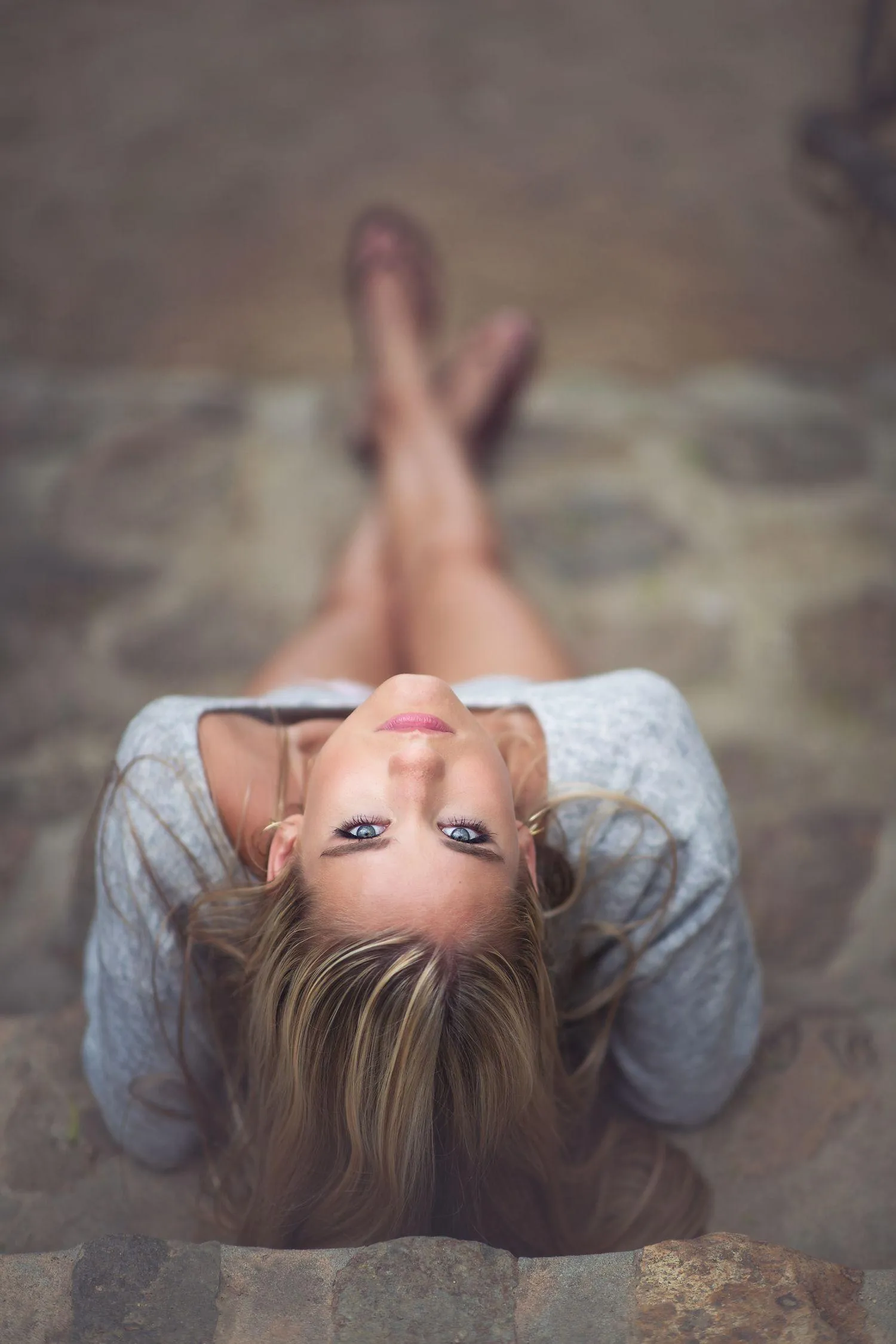 Woman Lying on the Floor with a Focus on Relaxed Facial Pose