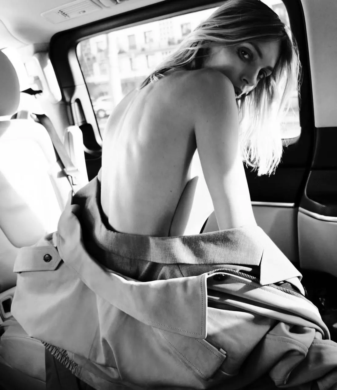 Woman Model Photo of a Woman Adjusting Her Bag Inside a Car