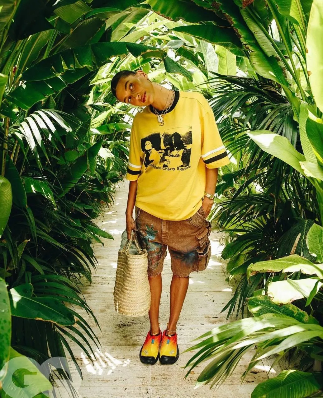 Woman Model Standing on a Tropical Path with Green Plants