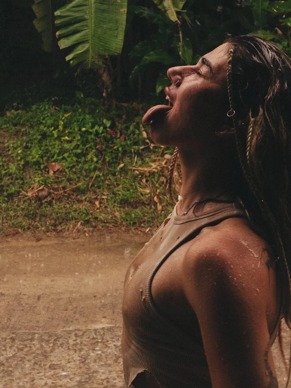 Woman Smiling While Standing in the Sunlight And Shadows