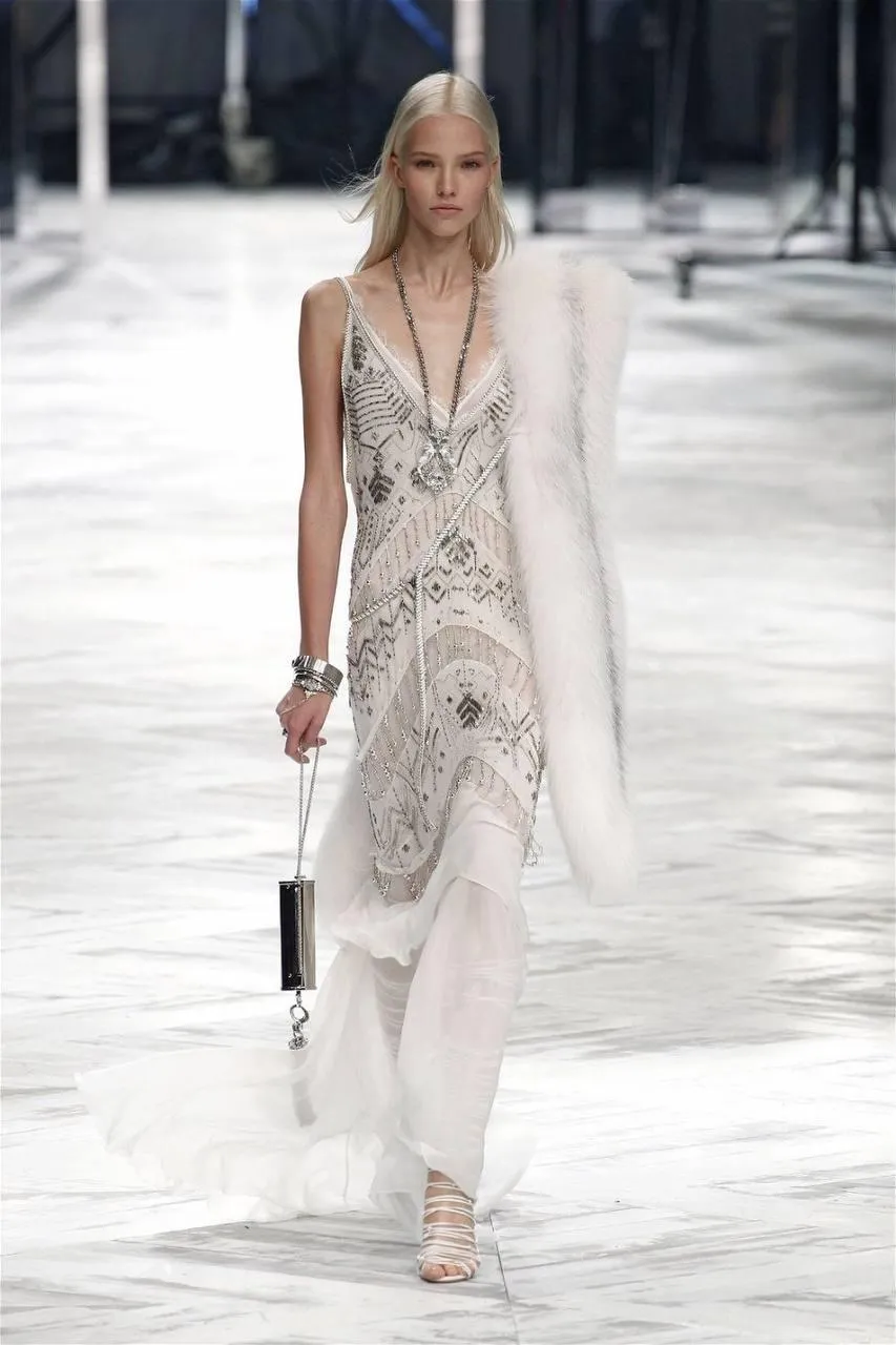 Woman Walking Runway in Light Colored High Fashion Dress