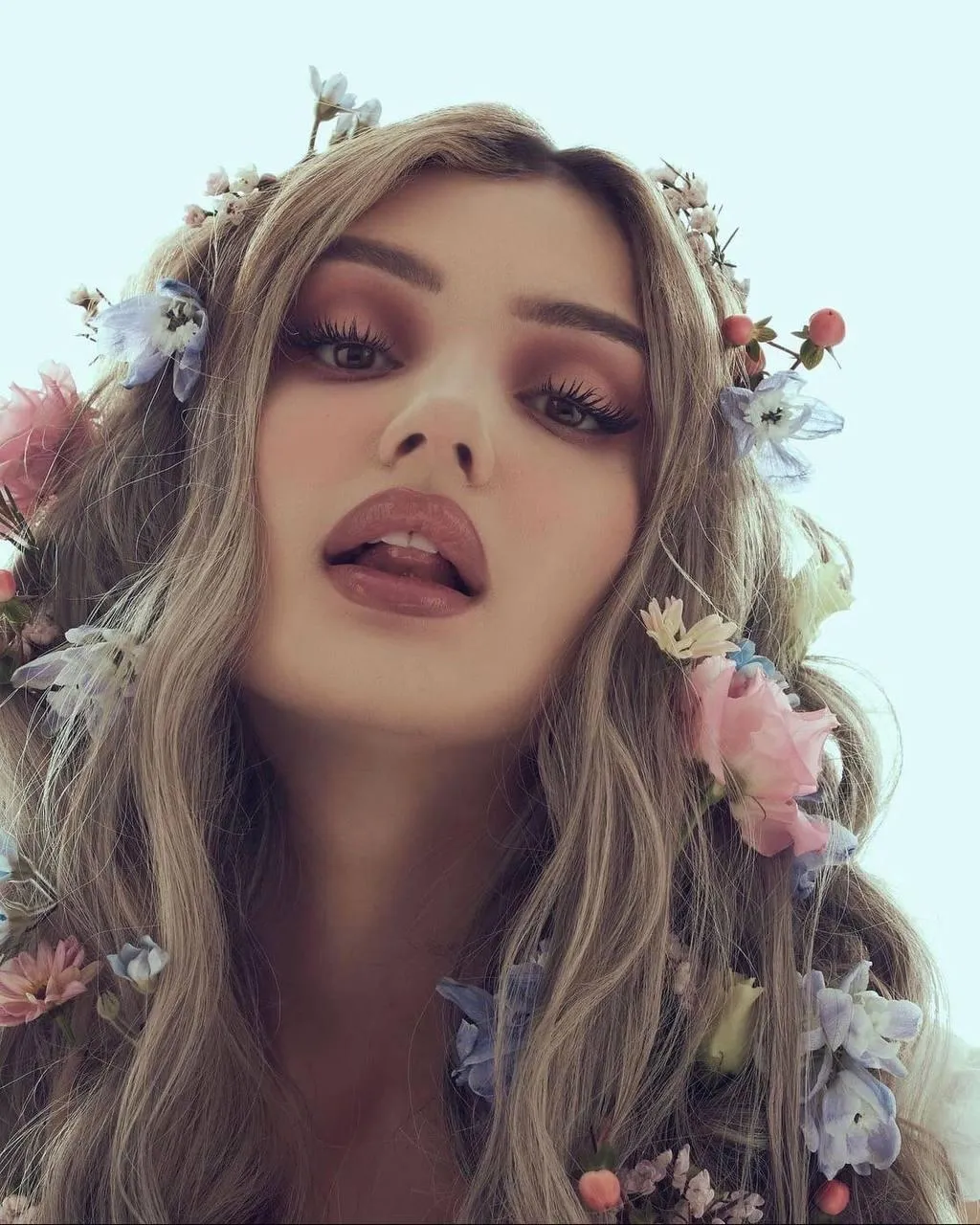 Woman with Flower Crown And Red Lips Looking Confidently