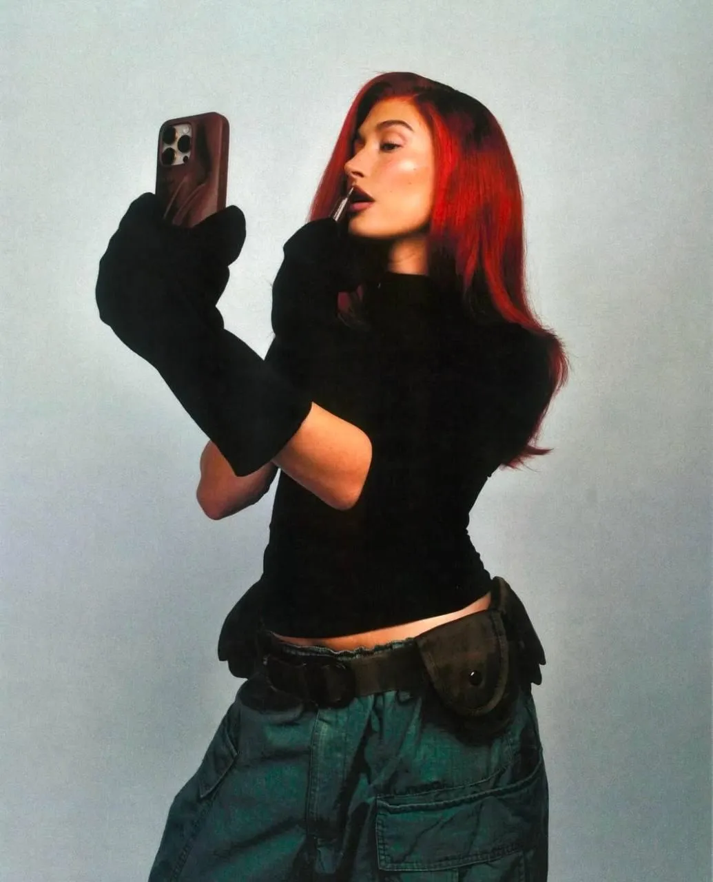 Woman with Red Hair Taking a Selfie Wearing a Black Top