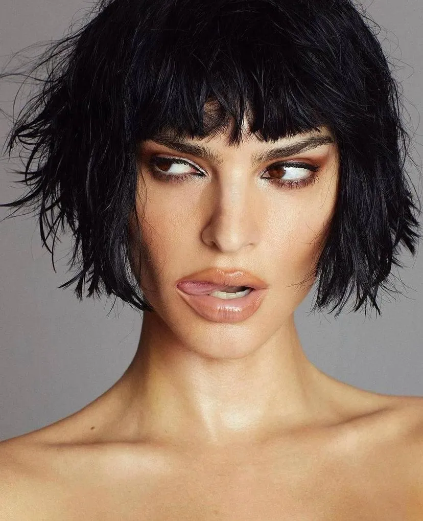 Woman with Short Hair And Bangs Looking To the Side Image