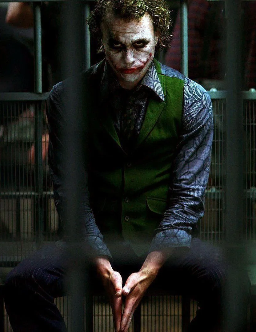Joker Sitting Alone in Prison Cell with Tense Death Stare