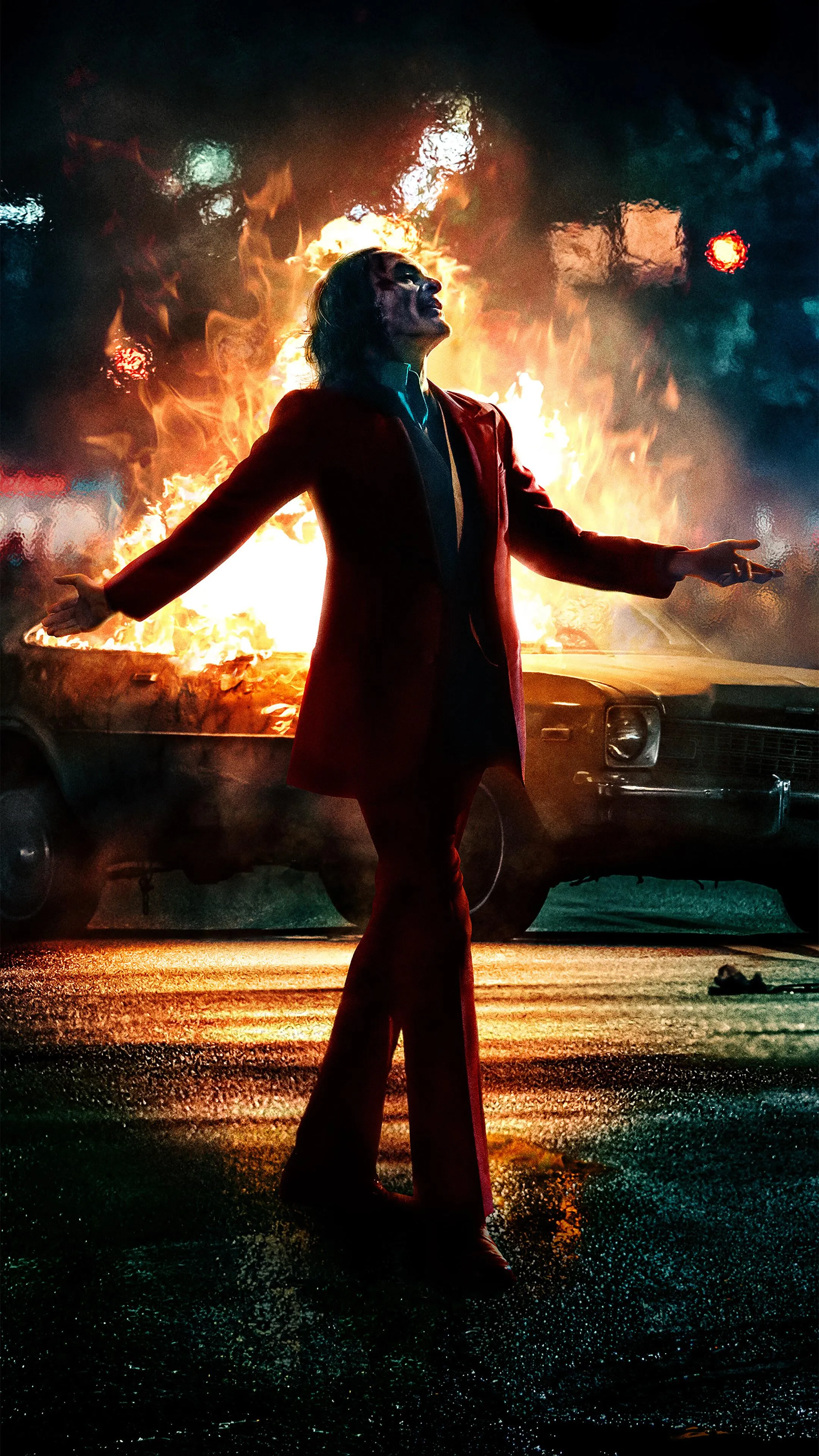 Joker Vibing in Front of A Burning Car HD Wallpaper Download