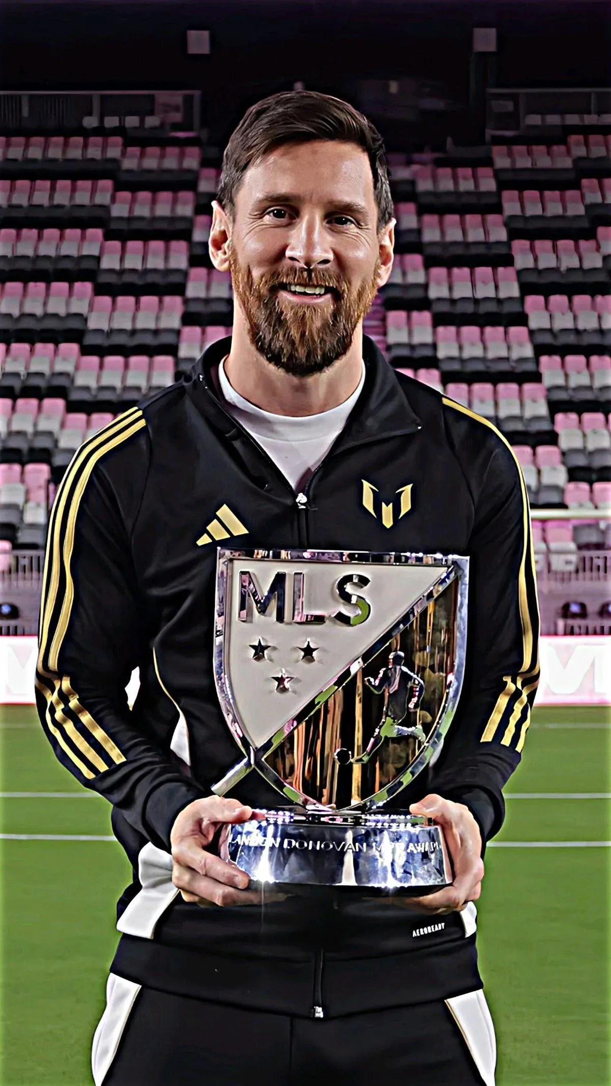 Lionel Messi In A Black Dress With A Gold And Silver Trophy