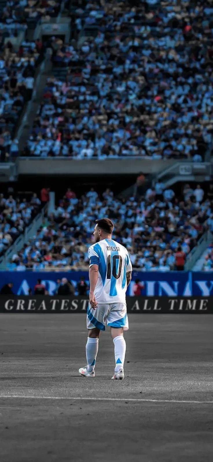 Lionel Messi Walking on The Ground With A Blue Jersey Image