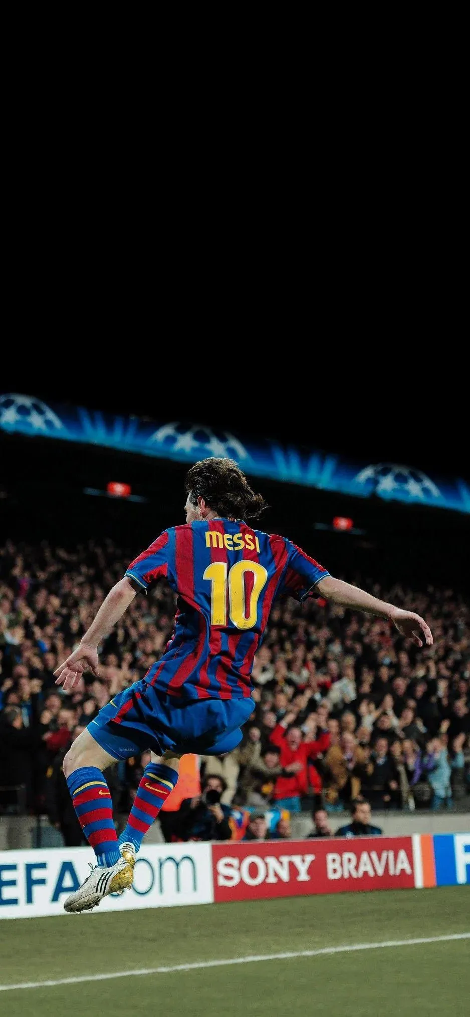 Messi Jumping To Catch The Ball on The Football Ground