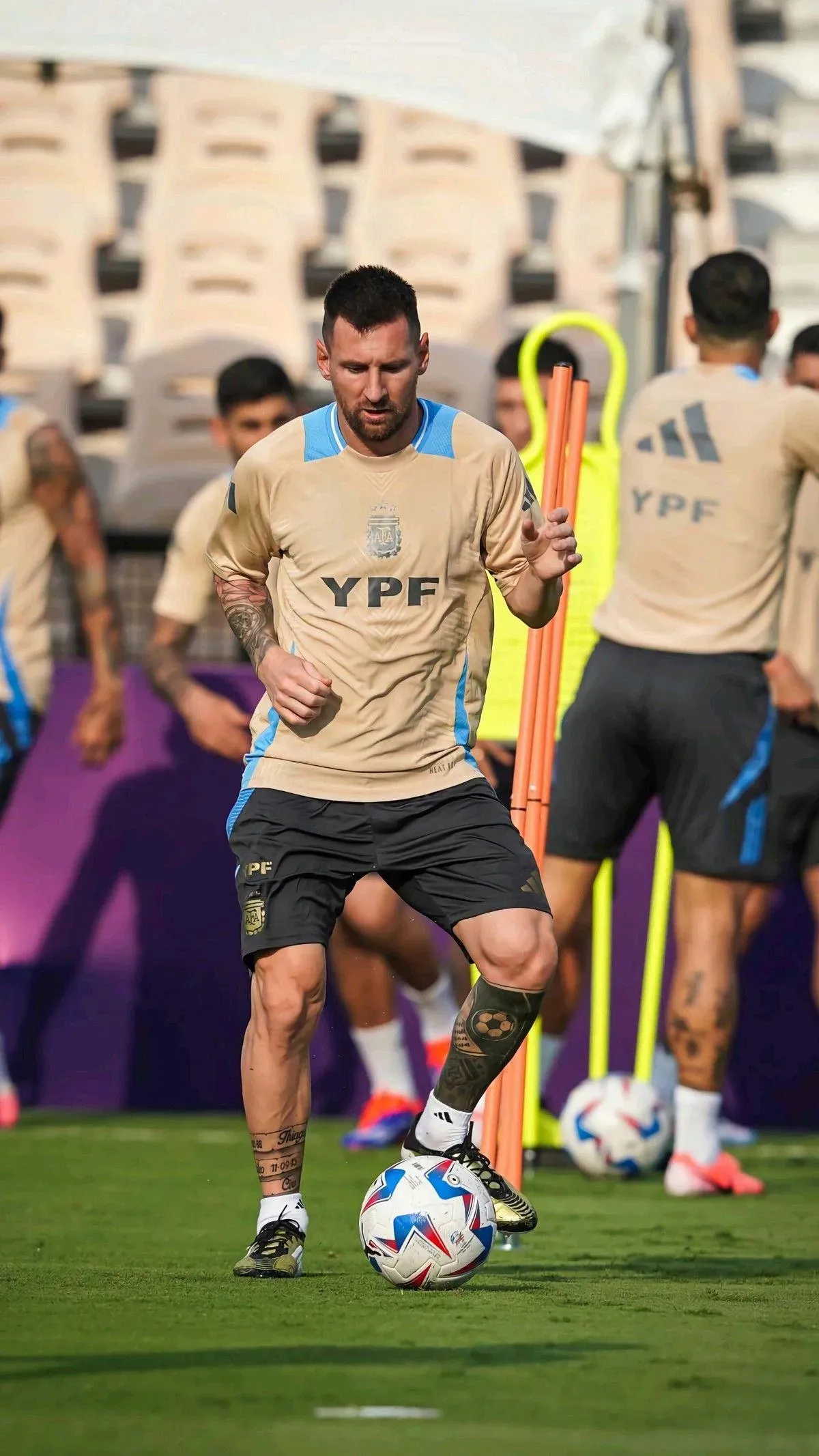 Messi Looking Intensely At Football Ground With Ball Image