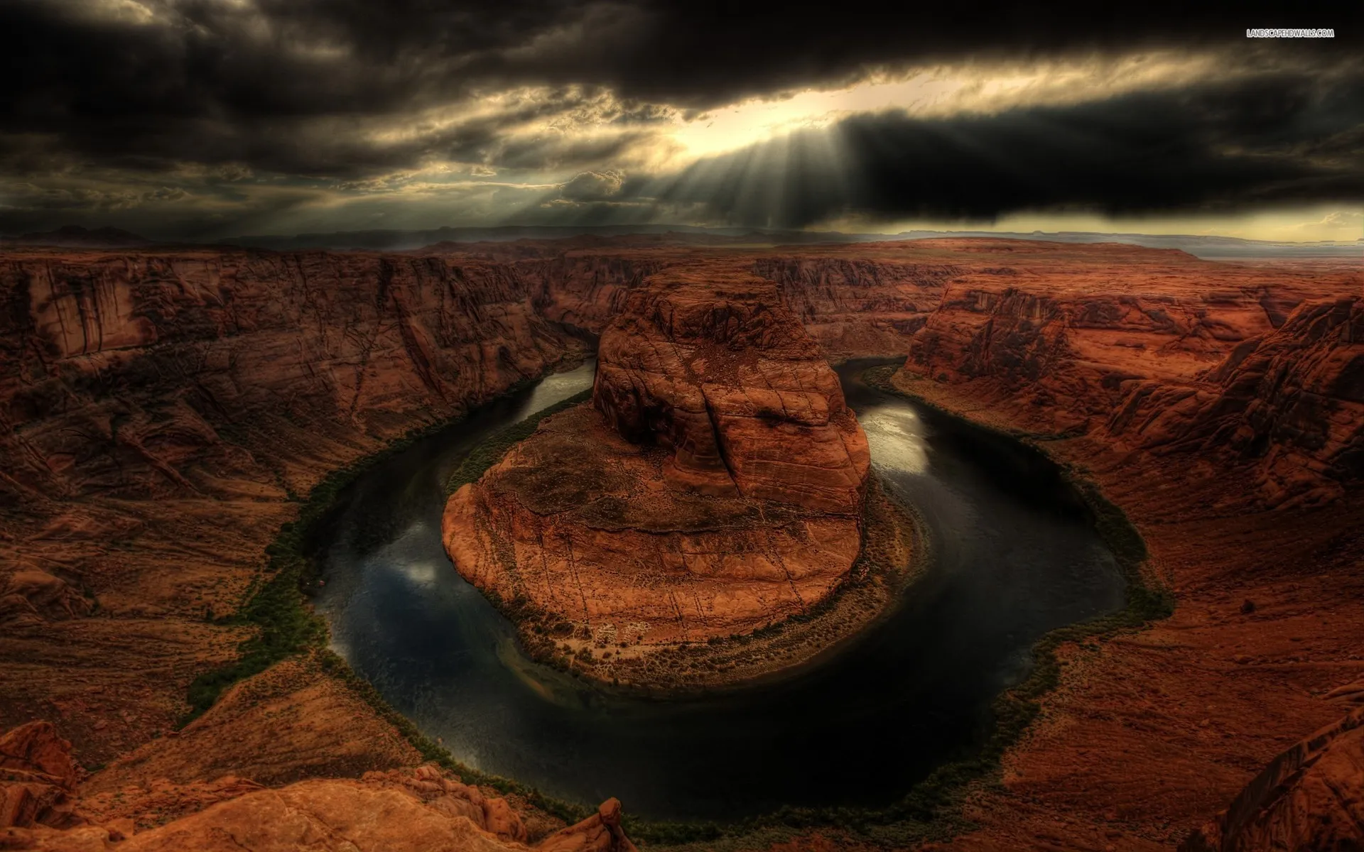 Aerial View of Canyon River Bend Under Dramatic Sky