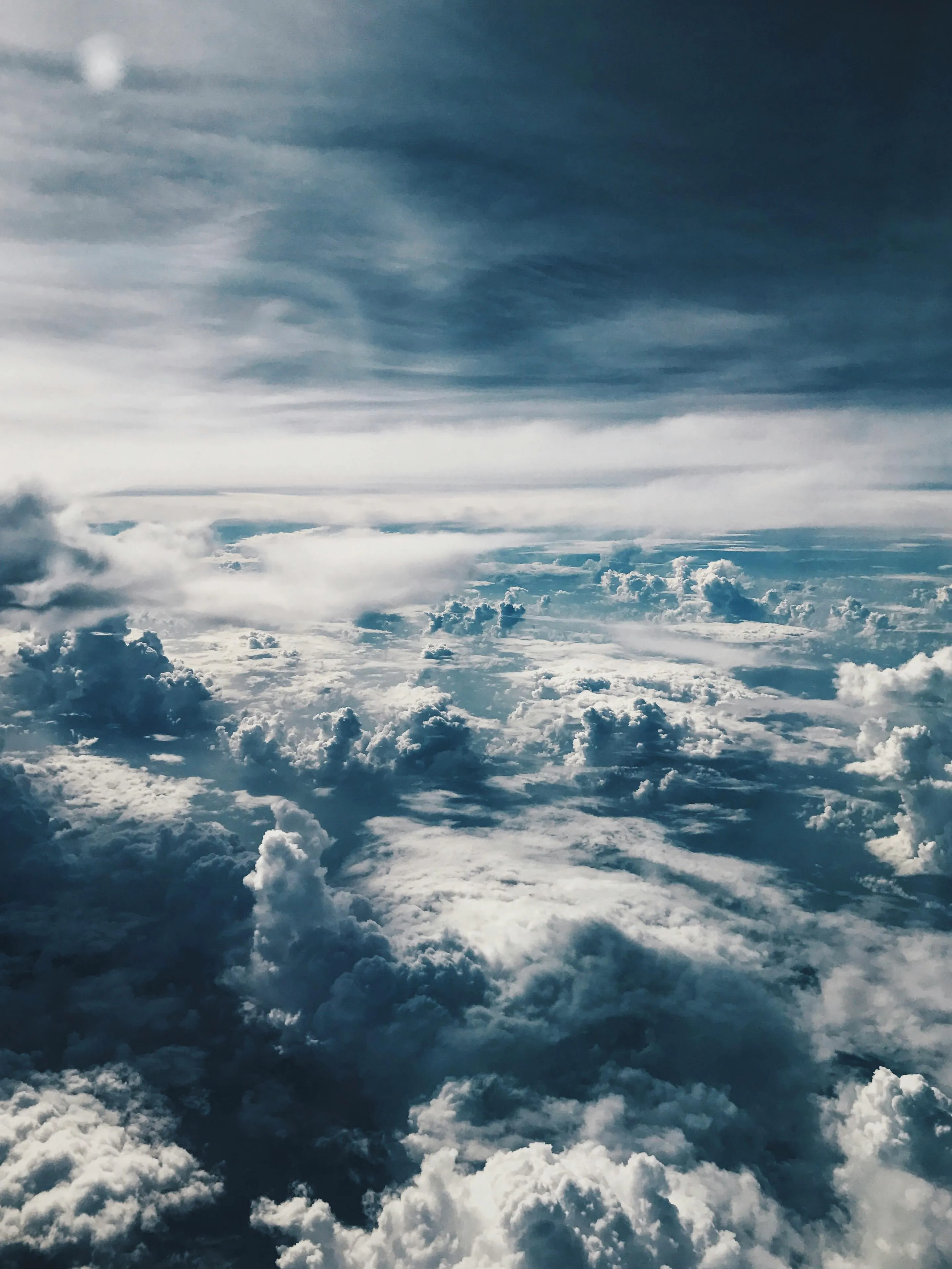 Aerial View of Thick Clouds with Sunlight Breaking Through