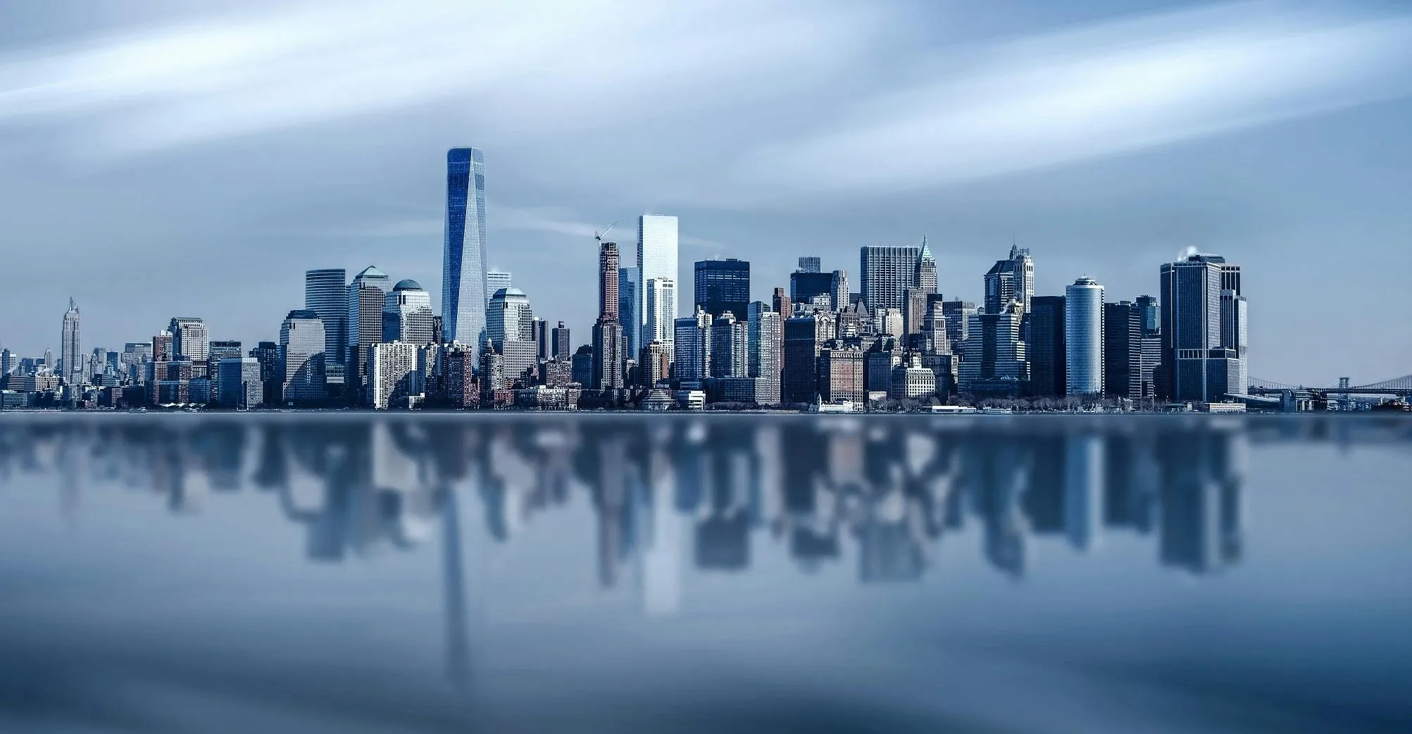 Amazing City Skyline Reflection Under Cloudy Blue Sky Wallpaper