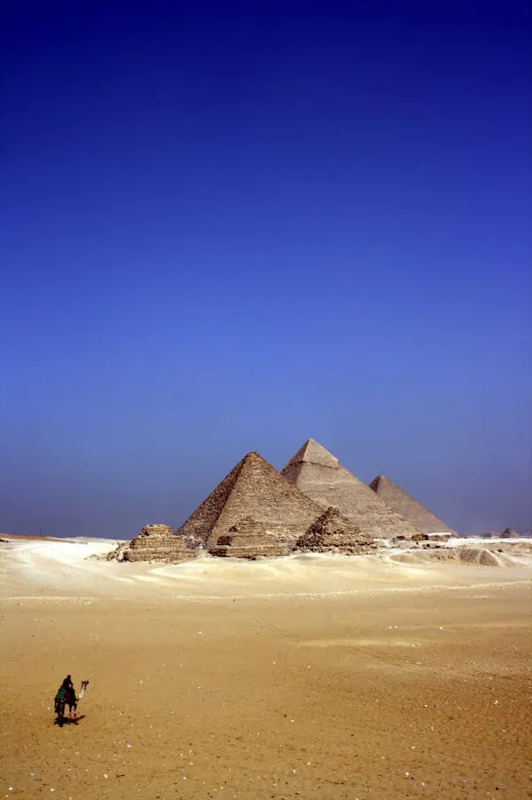 Ancient Pyramids Standing Tall Under Blue Cloudy Sky